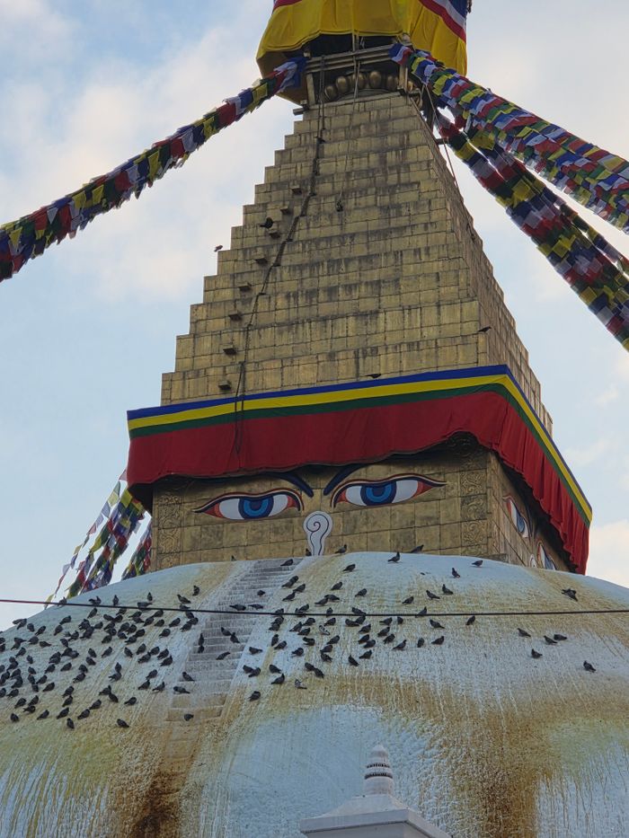 Stunning view of Boudhanath Stupa adorned with vibrant prayer flags in Kathmandu.